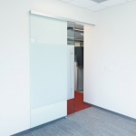 NxtWall sliding frameless glass door with soft open/close door mechanism