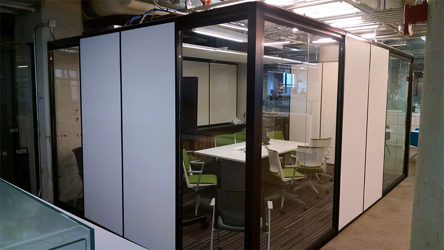 Freestanding Flex Series solid walls / View Series glass sidelights integrated office with black extrusions