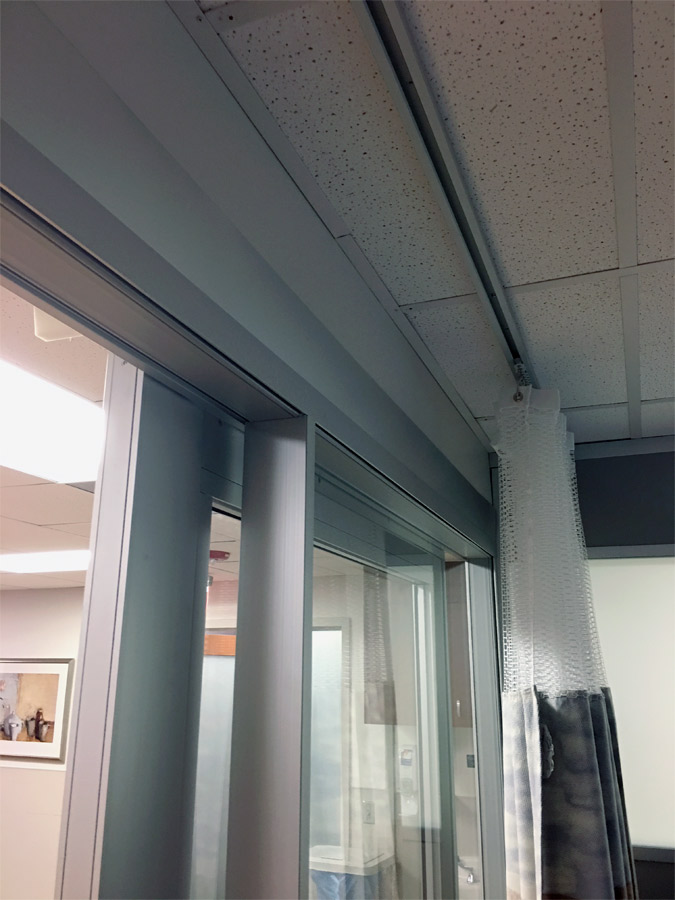 Patient room demountable walls with c-rail privacy curtains