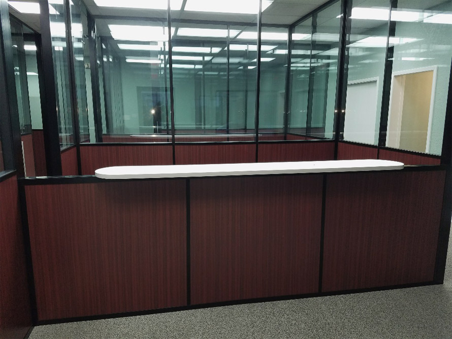 Reception top installation - wood base wall with glass top wall panels - Flex Series