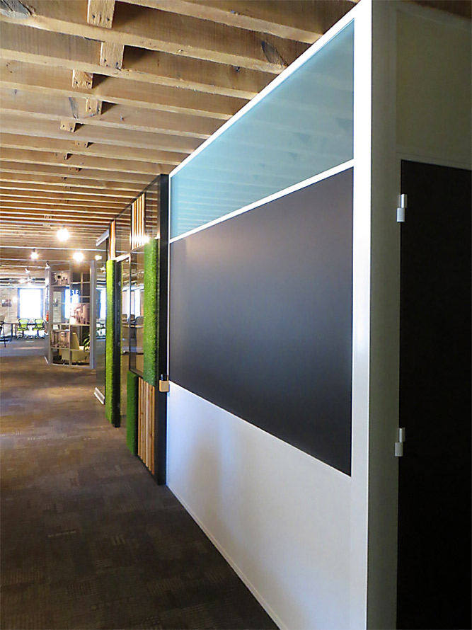 Frosted glass clerestory integrated chalkboard wall with white aluminum extrusions