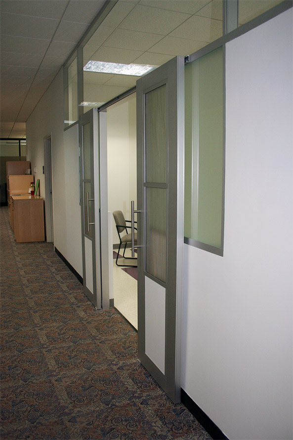 Double aluminum frame sliding doors with Flex series walls and opaque glass inserts