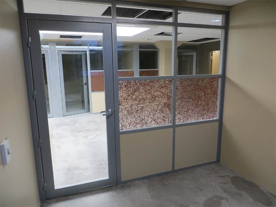 Offices with aluminum framed glass insert swing doors