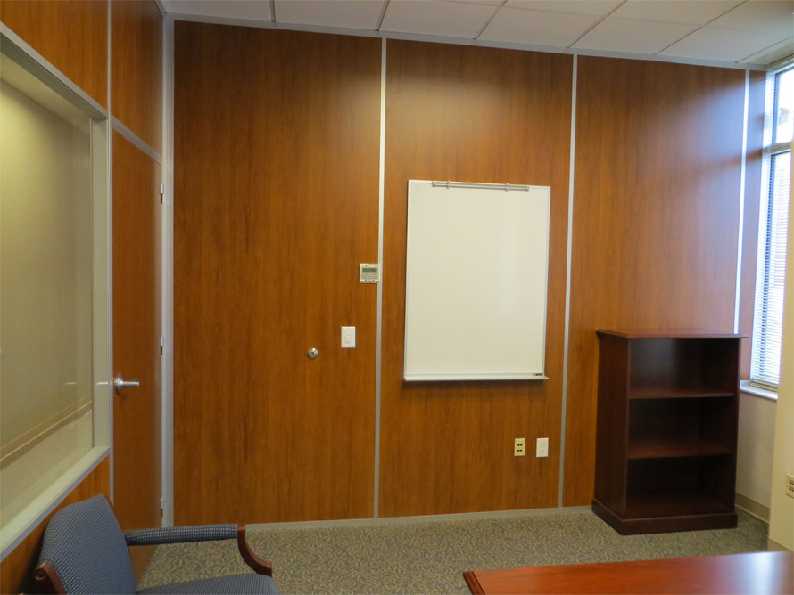 Wood wall office with solid wood swing door