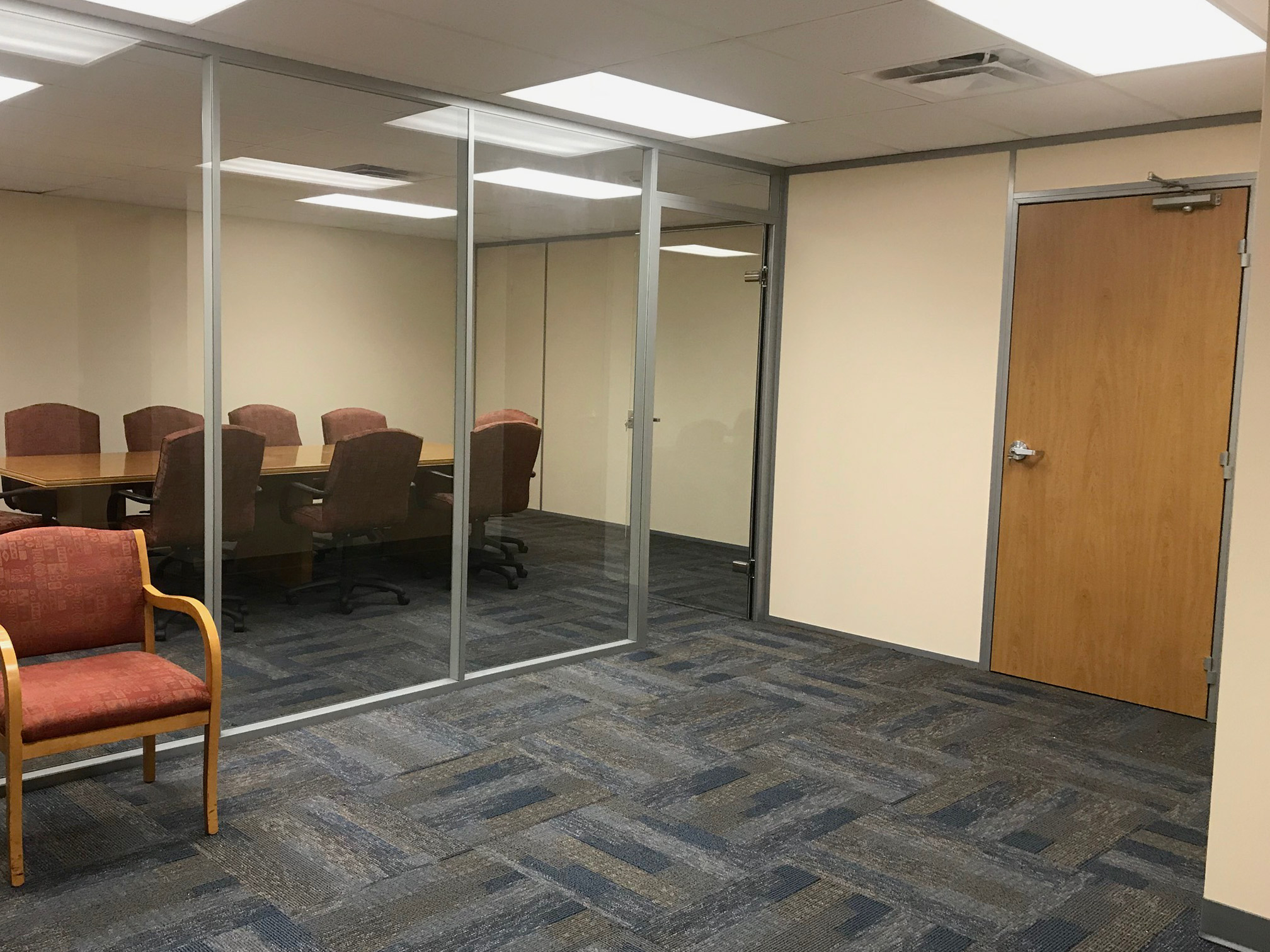 Glass conference room with swing doors - financial institution installation