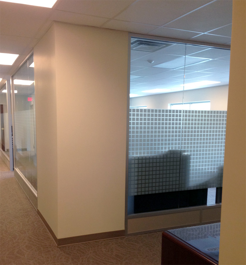 Glass office wall with square pattern frosted film