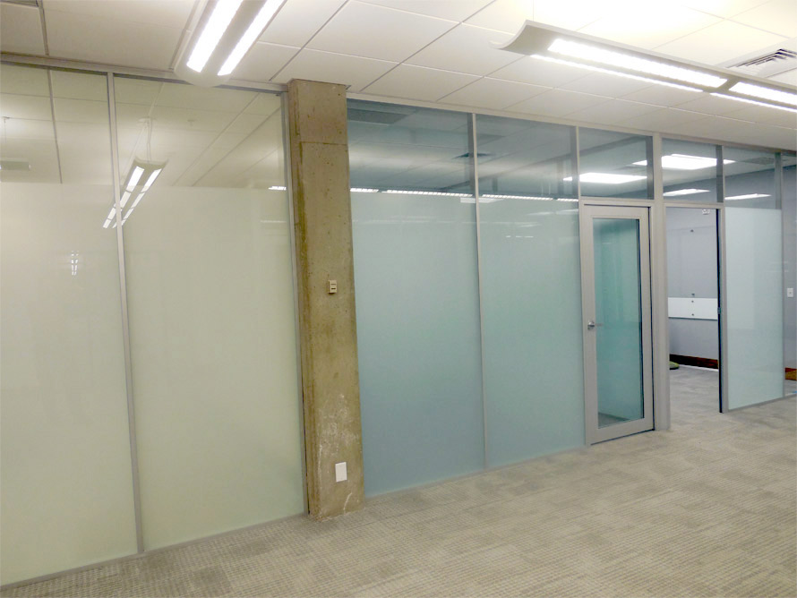 Privacy glass frosted full height wall system in University classroom application