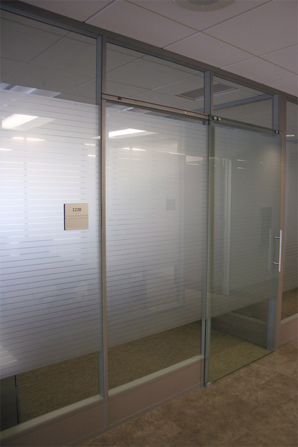 Sliding frameless glass door with matching privacy film