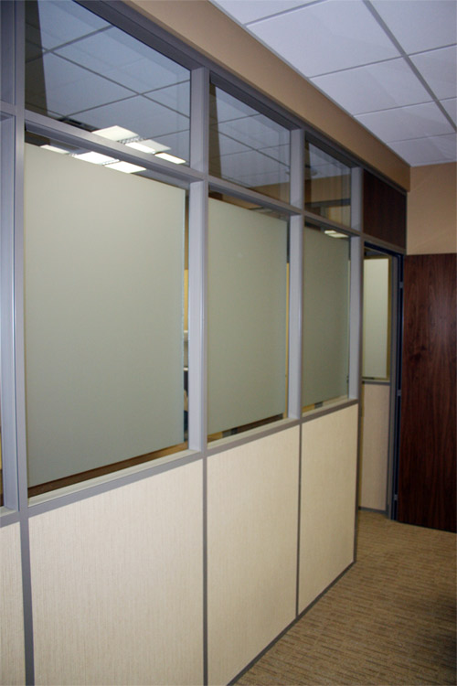 Frosted glass and clerestory wall with veneer wood door