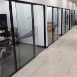Flex series glass offices and black colormatch extrusions installation