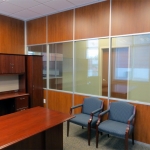 Solid laminate wood and glass panel Communication Center office