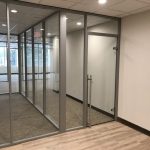 Glass walls with locking sliding glass door financial sector installation