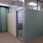Solid panel office with clerestory & aluminum framed glass door