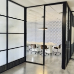 Black frame conference room with privacy glass film and electric power raceway