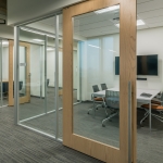NxtWall Flex Series offices with wood frame sliding doors