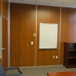 Wood wall office with solid wood swing door