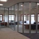 Segmented glass curved office walls