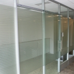 Office with privacy window film and sliding glass door