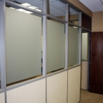Frosted glass and clerestory wall with veneer wood door