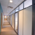 Solid wall panel offices with glass clerestory demountable wall partitions