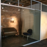Pocket door glass office with stainless flush pull door hardware