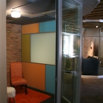 Freestanding breakout room with fabric acoustical wall and ceiling panels