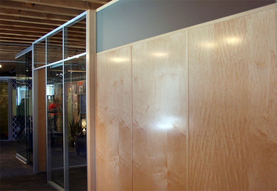 Veneer wall panels with matching veneer-wrapped wall trim