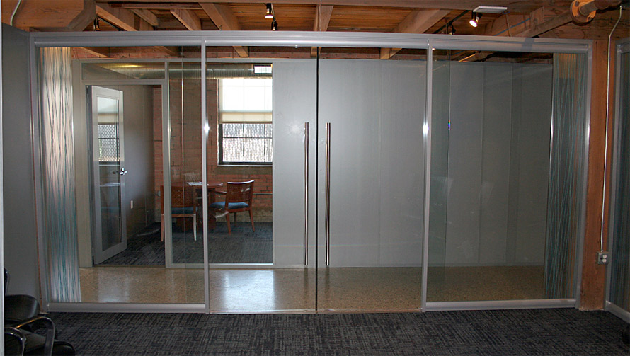 Double frameless glass sliding doors - conference room