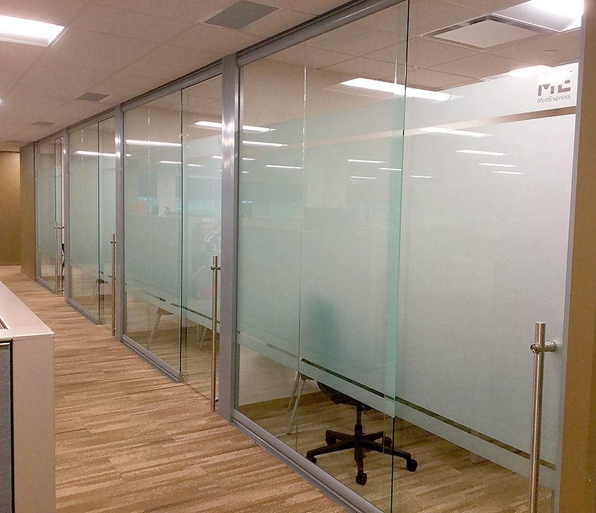 Glass offices with locking sliding frameless glass doors