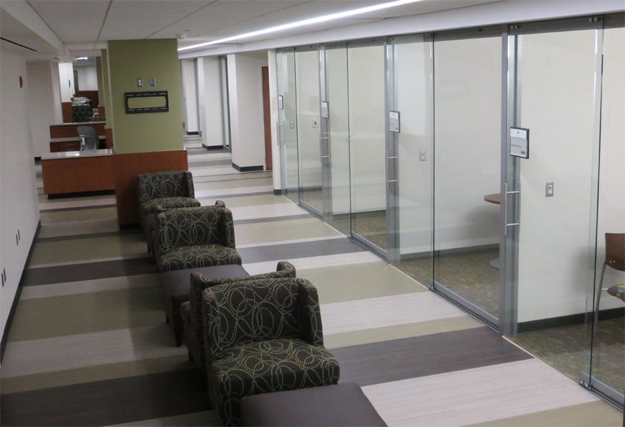Floor to ceiling glass walls with sliding frameless glass doors