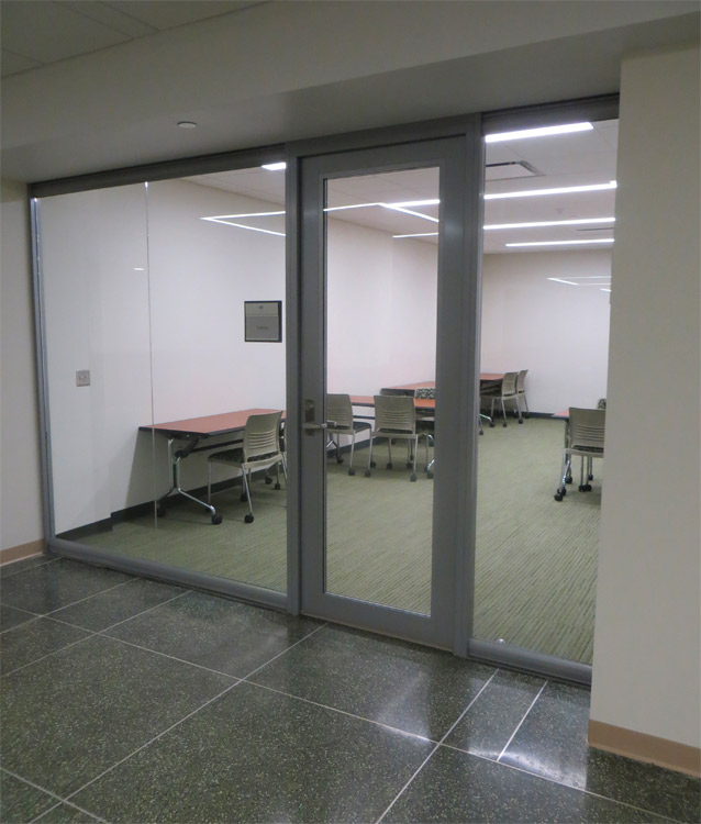 Center mounted seamless glass office (Higher Education)