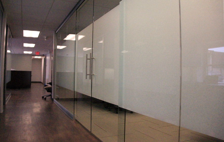 Double sliding glass door conference room with privacy film