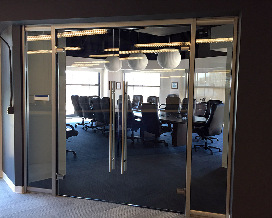 Glass conference room with frameless glass doors