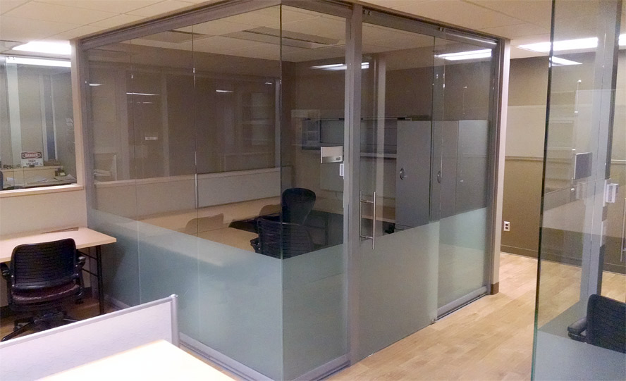 Glass office with frosted privacy film and sliding glass door