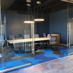 Conference room glass wall installation with sliding double doors