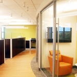 Curved glass office fronts with frameless glass swing door