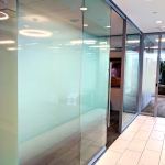 Elegant full height glass fronts with designer glass film applied