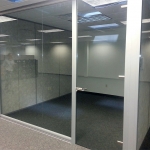 Glass office with frameless glass door