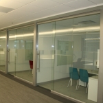 Glass offices with sliding glass doors