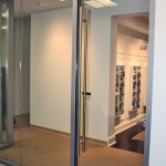View series glass front with full-height frameless swing door