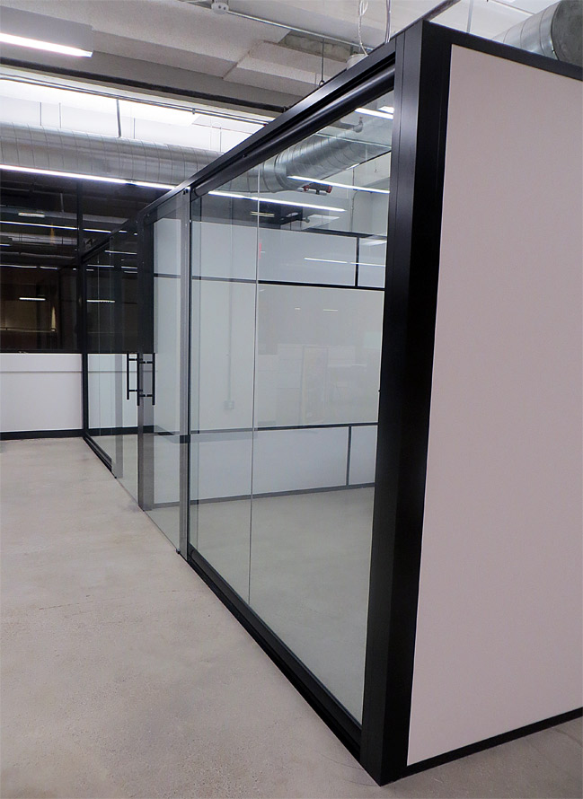 Freestanding View series glass office fronts with flex sidewalls