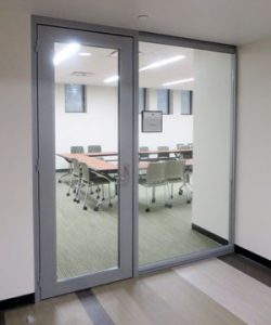 College University offices glass wall front with swing door. View demountable wall series Nxtwall