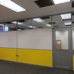 clerestory demoutnable walls with yellow and white panels in college classroom