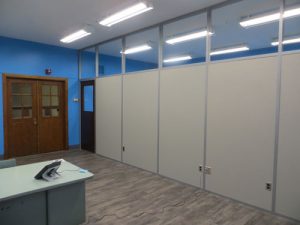 retrofitting classrooms in higher education with clerestory demountable walls and old school doors.