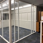 Flex Series demountable wall glass office with field-fit installation wrapping light fixtures #1799