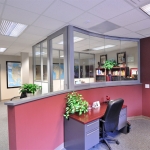 Flex Series wall fronts with View Series curved glass half wall #0581