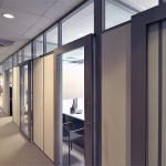 Enclosed offices with sliding aluminum framed glass doors #0585