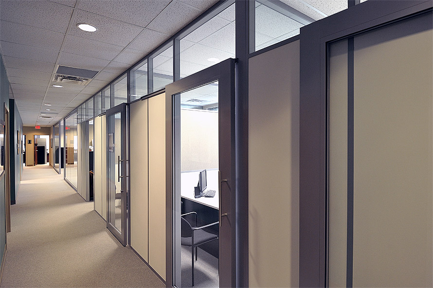 Enclosed offices with sliding aluminum framed glass doors #0585