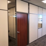 Demountable wall office with wood door - Brownstone frame color paired with clay stud bead #1201