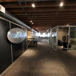 Flex Series Feature Wall with Stainless Steel LED Logo - NxtWall Chicago Showroom #0995